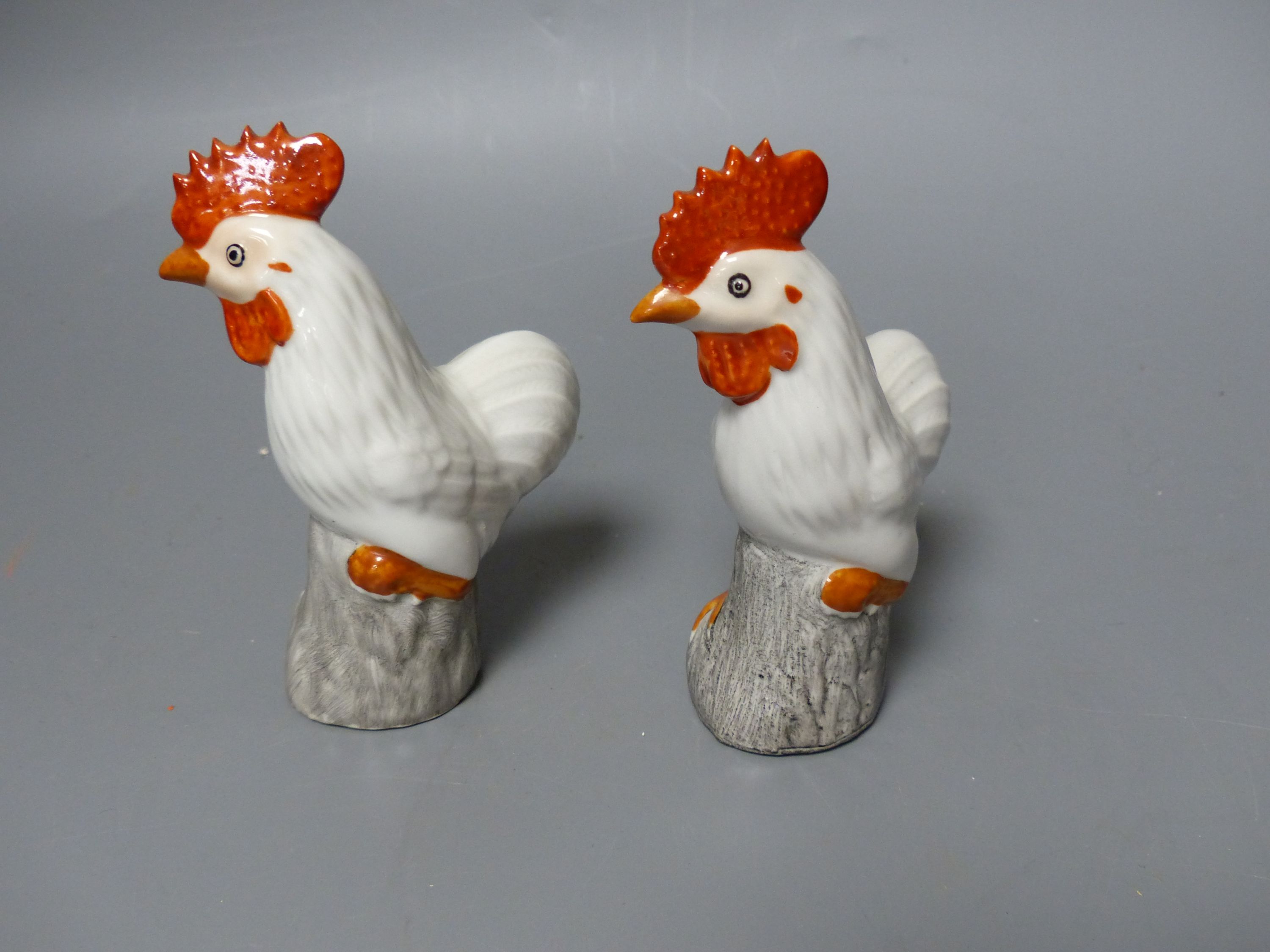 Two pairs of Chinese porcelain cockerels, tallest 20cm